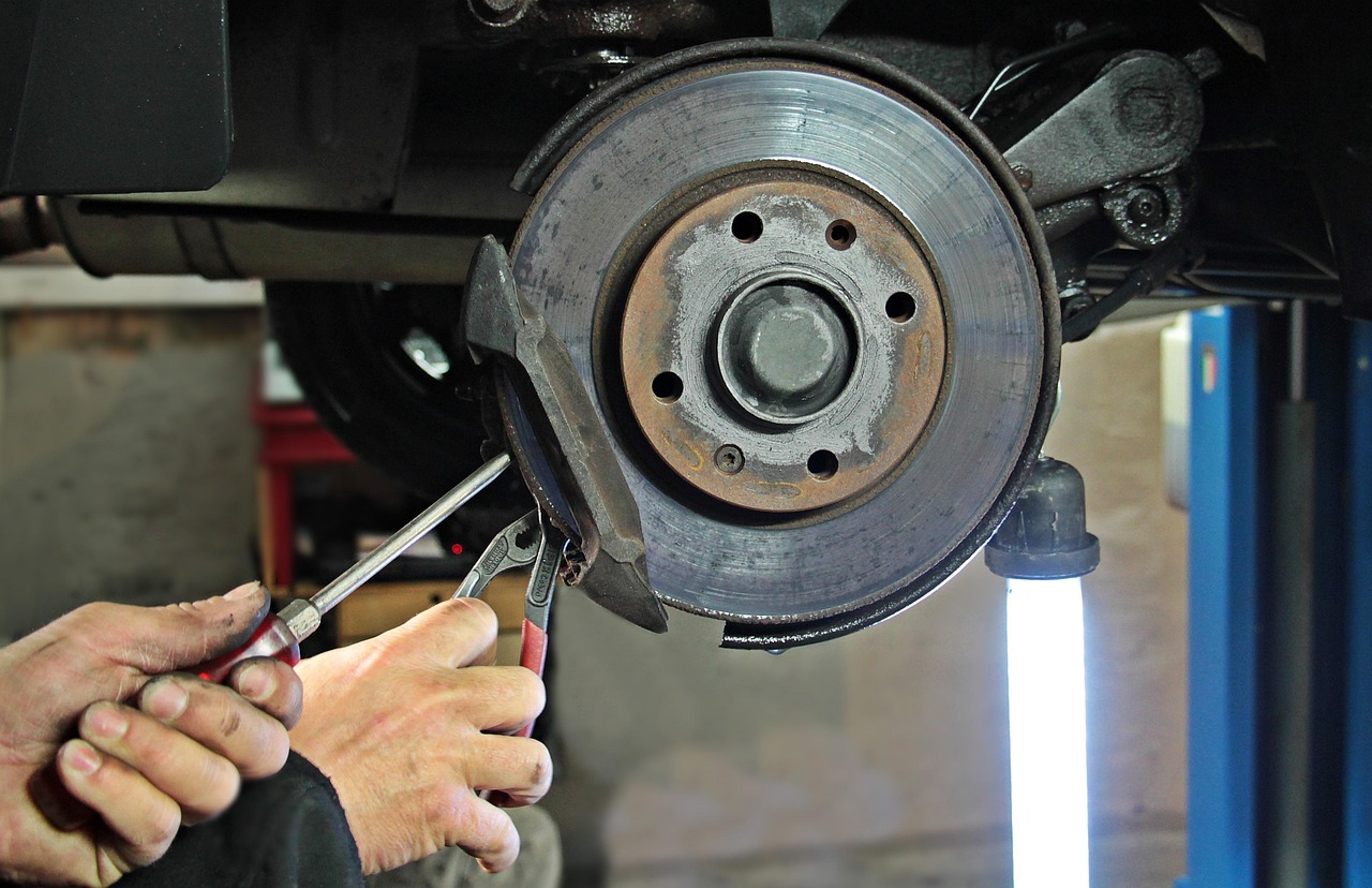 Mechanic servicing a brake disc